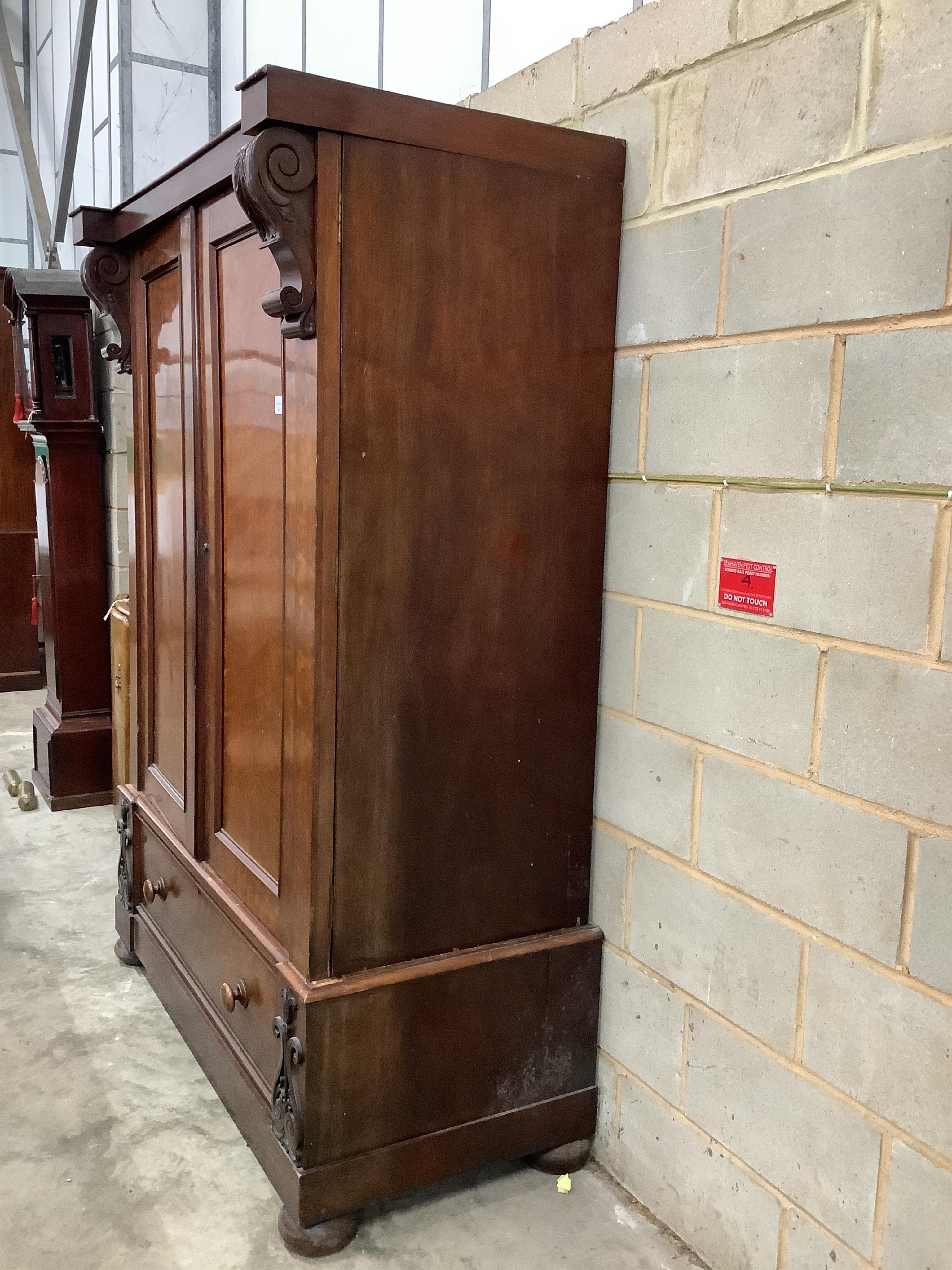 An early Victorian mahogany compactum wardrobe, width 140cm, depth 72cm, height 200cm. Condition - fair